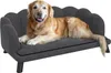 A golden retriever dog is lying on a dark gray dog sofa. Podgląd zdjęcia produktu