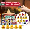 A hand holding a Christmas-themed rubber duck in front of a Christmas advent calendar. Produktbild-Vorschau