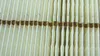A close-up view of a pleated air filter. Voir les images du produit