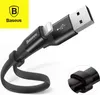 A close-up product shot of a black USB to Lightning charging cable with a built-in cable clip, against a white background. The Baseus logo is visible in the top left corner. Anteprima dell’immagine prodotto