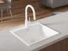 A white kitchen sink with a white faucet is shown on a light gray countertop. Produktbild-Vorschau