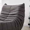 A close-up view of a textured gray sofa. Produktbild-Vorschau