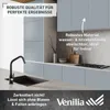 A modern kitchen with blue cabinets and a black sink and faucet. Produktbild-Vorschau
