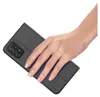 A hand is holding a black smartphone case. Anteprima dell’immagine prodotto
