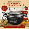 A black cast aluminum pot with a glass lid is displayed on a wooden surface with herbs and tomatoes. Anteprima dell’immagine prodotto