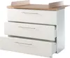 A white dresser with a wooden top and a changing pad attachment. Produktbild-Vorschau