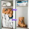 A split image showing the difference between disorganized and organized storage of bedding and stuffed animals using vacuum bags. Voir les images du produit