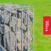 A gabion basket filled with stones, set against a green grassy background. Produktbild-Vorschau