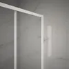 A close-up view of a shower enclosure with a white frame and clear glass panels, set against a marble-patterned wall. Anteprima dell’immagine prodotto