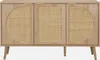 A light wood sideboard with three doors, two of which have circular rattan inserts and one has a rectangular rattan insert. The sideboard stands on four tapered legs. Anteprima dell’immagine prodotto