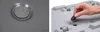 A collage showing a close-up of a planter's drainage holes and a hand inserting a rubber stopper into a hole on the bottom of a planter. Produktbild-Vorschau