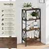 A tall, narrow bookshelf with a dark wood finish and black metal frame, decorated with various items on its shelves. Produktbild-Vorschau