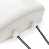 A close-up view of the bottom of a white outdoor electronic device, showing two cable glands with black cables passing through them. Náhled obrázku produktu