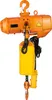 An orange electric chain hoist with a yellow cover and a black control cable is shown against a white background. Anteprima dell’immagine prodotto