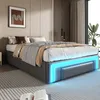 A modern bedroom with a bed as the central focus, featuring ambient blue LED lighting. Produktbild-Vorschau