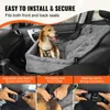 A dog sitting in a car seat booster designed for pets. Náhled obrázku produktu