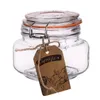 A clear glass jar with a wire bail closure and an orange rubber seal, tied with twine and a brown paper tag. Náhled obrázku produktu