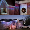 Collage of images showing Christmas lights on houses and a wreath on a door. Produktbild-Vorschau