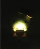 A glowing Hello Kitty plush toy sitting in darkness. Anteprima dell’immagine prodotto