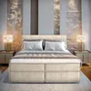 A bedroom scene with a large bed as the focal point. Produktbild-Vorschau