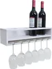 A white wooden wine rack mounted on a wall, holding two bottles of red wine and six wine glasses. Podgląd zdjęcia produktu