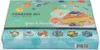 A product box for an edible flower starter kit, showing a cake decorated with edible flowers. Produktbild-Vorschau