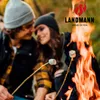 A couple roasting marshmallows over a campfire. Produktbild-Vorschau