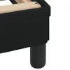Close-up of a black fabric bed frame with wooden slats and a black cylindrical leg. Produktbild-Vorschau