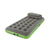 A gray inflatable air mattress with a green border and a small pillow on top, isolated on a white background. Podgląd zdjęcia produktu