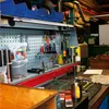 A workbench in a workshop with tools and equipment. Anteprima dell’immagine prodotto