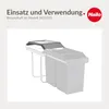 A product shot of a dark gray lid for a waste bin system, shown mounted on a white frame with two gray bins underneath. The background is a light gray and white gradient. Produktbild-Vorschau