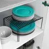 A shelf organizer holding stacks of plates inside a cabinet. Podgląd zdjęcia produktu
