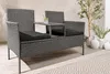 A modern gray polyrattan garden bench with a built-in table and black cushions, placed on a wooden deck with a patterned rug and decorative vases in the background. Produktbild-Vorschau