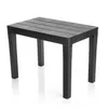 A black plastic side table with a slatted top and four legs, shown in a studio setting with a white background and reflection. Produktbild-Vorschau