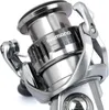 A close-up studio shot of a silver fishing reel. Produktbild-Vorschau