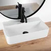 A white rectangular vessel sink with a black faucet is shown on a wooden countertop, with a mirror reflecting the scene. Podgląd zdjęcia produktu