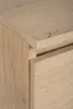 A close-up shot of the corner of a wooden cabinet, showing the grain of the wood and the edge of a drawer. Podgląd zdjęcia produktu