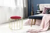 A bedroom scene with a stool and a bed. Produktbild-Vorschau