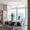 A modern office interior with a desk, chairs, and a large window overlooking a city skyline. Voir les images du produit
