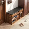 A shoe cabinet with a bench in an entryway, next to a door and a closet. Náhled obrázku produktu