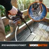 A person is using a cordless pressure washer to clean a wooden deck. Produktbild-Vorschau