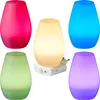 A collage of five LED plug-in night lights in different colors, with one unit showing its plug and motion sensor. Produktbild-Vorschau
