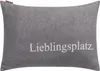 A gray pillow with the word "Lieblingsplatz" embroidered on it. Produktbild-Vorschau