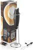 A black electric milk frother and its packaging, displayed with accessories. Produktbild-Vorschau