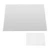 A large, flat, rectangular stainless steel cutting board is shown from a slightly elevated angle, with a smaller white rectangular piece of paper below it. Both items are on a white background. Náhled obrázku produktu