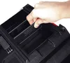 A hand is shown adjusting a divider inside a black tool organizer. Náhled obrázku produktu