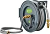 A wall-mounted hose reel with a gray hose and brass fittings. Produktbild-Vorschau