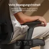 A person's arm resting on the armrest of an office chair, with text overlay describing the chair's features. Podgląd zdjęcia produktu