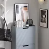 A hallway or entryway scene with a shoe cabinet, artwork, and accessories. Produktbild-Vorschau