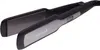 A close-up, angled shot of a black and gray Remington hair straightener against a white background. Podgląd zdjęcia produktu